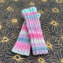 Load image into Gallery viewer, Pair of knitted leg warmers with pink and blue stripes on a floral patterned background